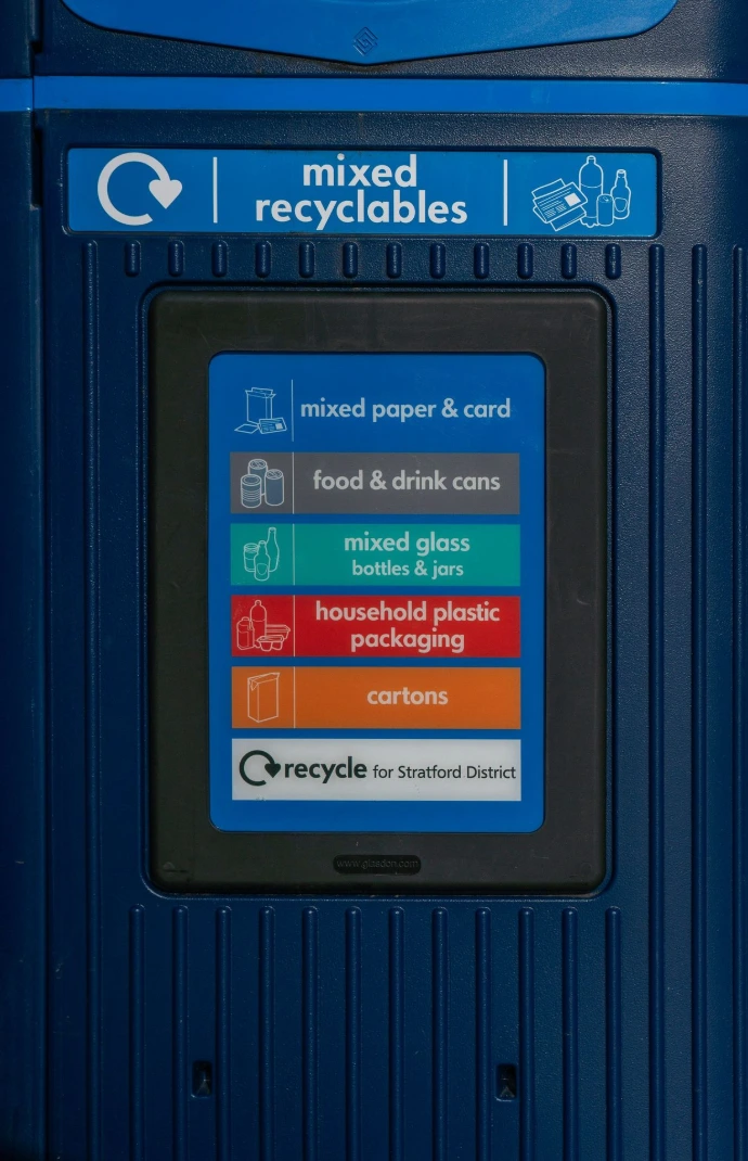 Recycling bin with categories for mixed recyclables.